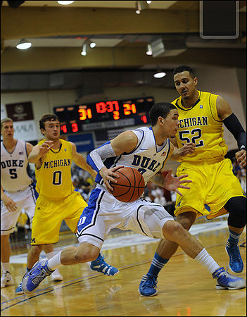 Zack Novak (0) and Jordan Morgan (52)