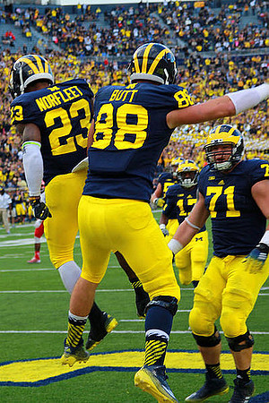 Dennis Norfleet (23), Jake Butt (88), and Ben Braden (71)