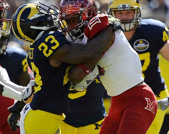 Dennis Norfleet (23) and Jake Ryan (47)