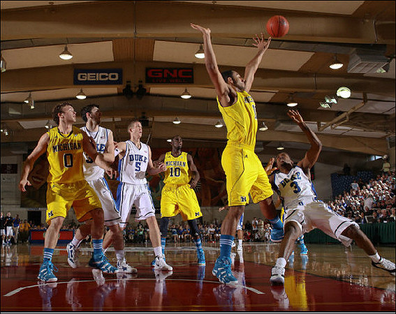 Zack Novak (0), Tim Hardaway Jr. (10), and Jon Horford (15)