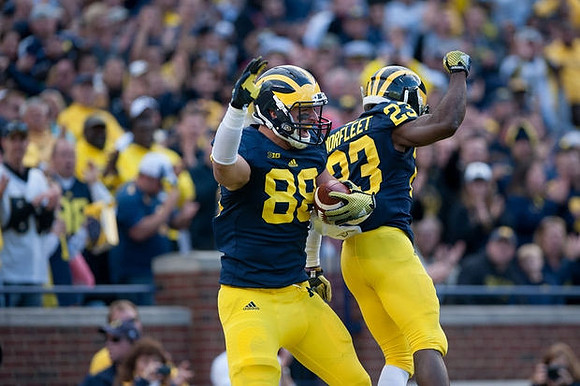 Jake Butt (88) and Dennis Norfleet (23)