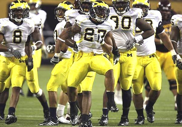 Jonas Mouton (8), Brandon Harrison (27), and Tim Jamison (90)