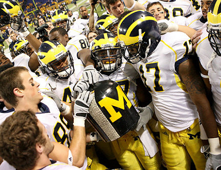 Jon Conover (89), Toney Clemons (17), and the Little Brown Jug