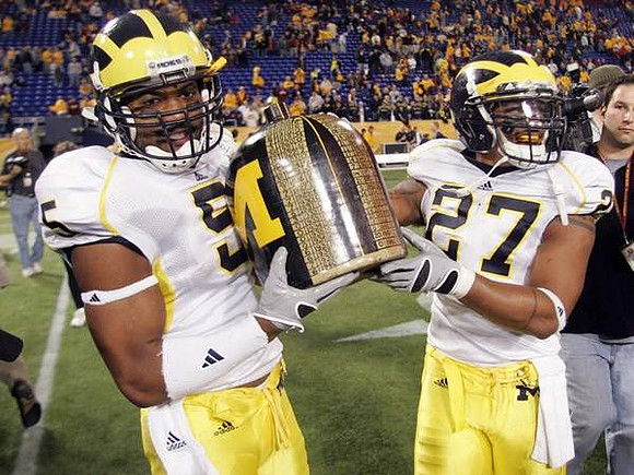 Charles Stewart (5), Brandon Harrison (27), and the Little Brown Jug