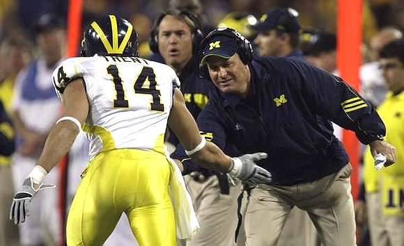 Morgan Trent (14) and Rich Rodriguez