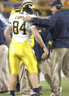 K.C. Lopata (84) and Rich Rodriguez