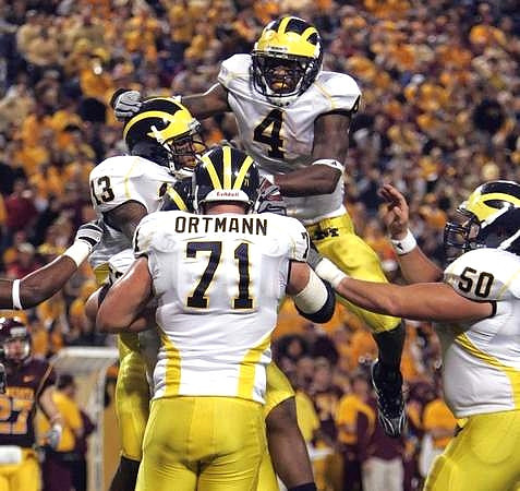 Greg Mathews (13), Mark Ortmann (71), Brandon Minor (4), and David Molk (50)