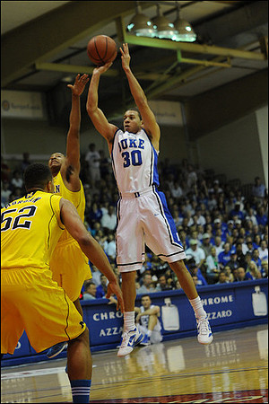 Jordan Morgan (52) and Trey Burke (3)