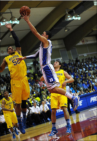 Trey Burke (3), Jordan Morgan (52), and Zack Novak (0)