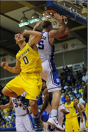 Zack Novak (0) and Trey Burke (3)