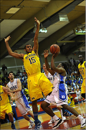 Zack Novak (0), Jon Horford (15), and Tim Hardaway Jr. (10)