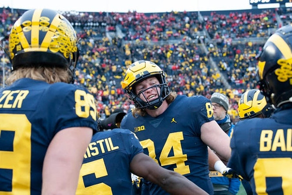 Carter Selzer (89), Mike Sainristil (5), Joel Honigford (84), and Daylen Baldwin (85)