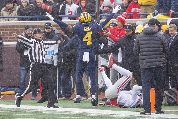 Vincent Gray (4) and Jim Harbaugh