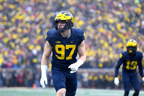 Aidan Hutchinson (97) and Rod Moore (19)