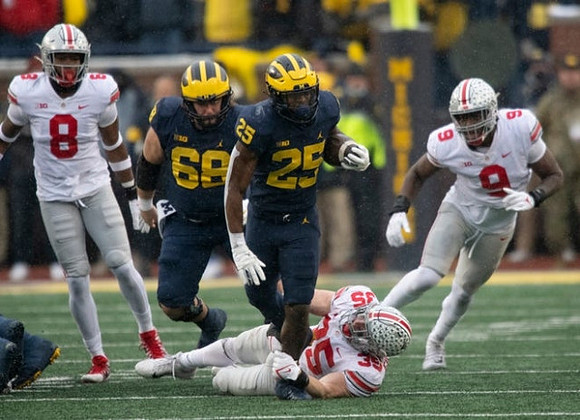 Andrew Vastardis (68) and Hassan Haskins (25)