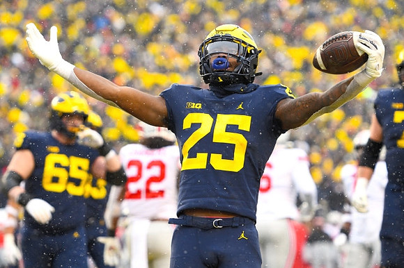 Zak Zinter (65) and Hassan Haskins (25)
