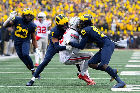Michael Barrett (23), Vincent Gray (4), and Rod Moore (19)