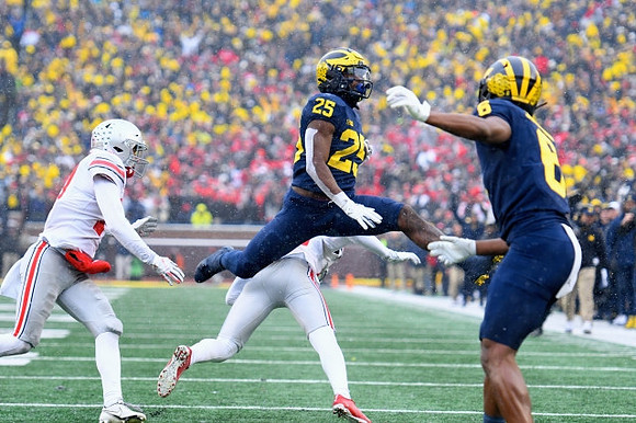 Hassan Haskins (25) and Cornelius Johnson (6)