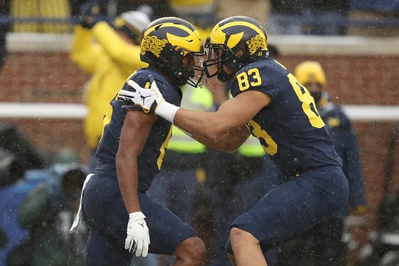 Cornelius Johnson (6) and Erick All (83)