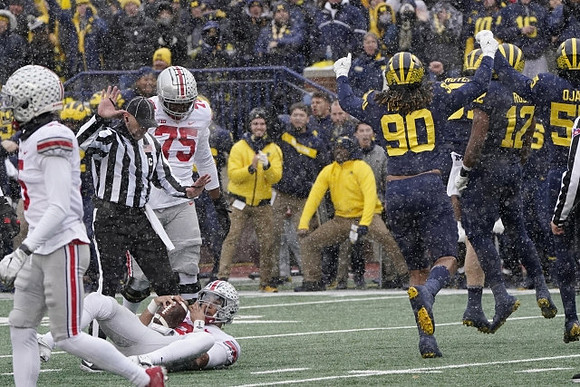 Mike Morris (90), Josh Ross (12), and David Ojabo (55)