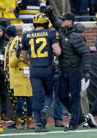 Cade McNamara (12) and Jim Harbaugh