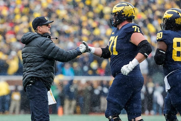 Jim Harbaugh, Andrew Stueber (71), and Trente Jones (80)