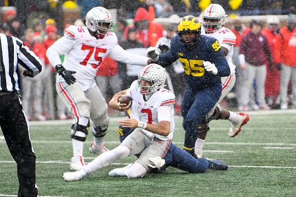 David Ojabo (55) and Donovan Jeter (95)
