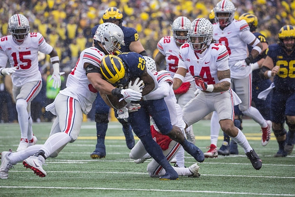 Zak Zinter (65), Hassan Haskins (25), Andrew Stueber (71), and Andrew Vastardis (68)