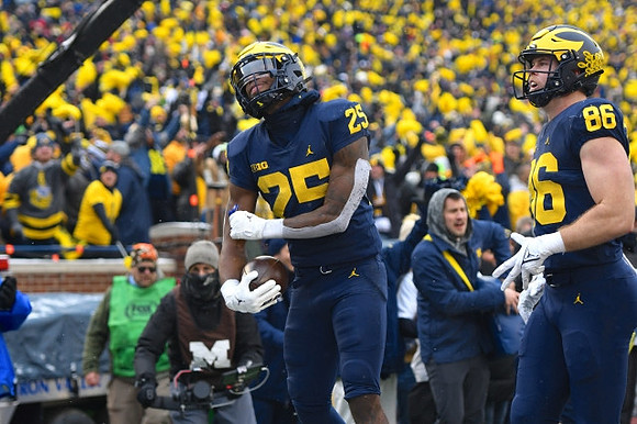 Hassan Haskins (25) and Luke Schoonmaker (86)