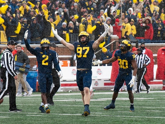 Brad Hawkins (2), Aidan Hutchinson (97), and Daxton Hill (30)
