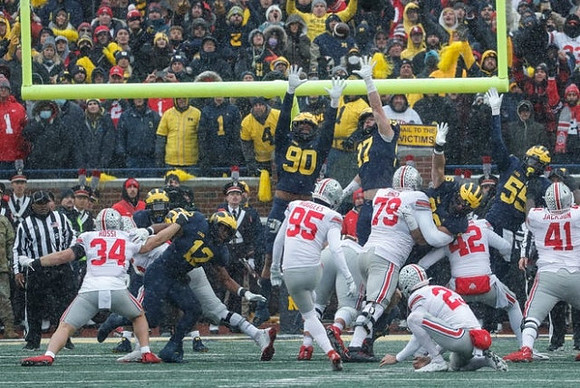 Josh Ross (12), Mike Morris (90), Aidan Hutchinson (97), Caden Kolesar (35), and David Ojabo (55)