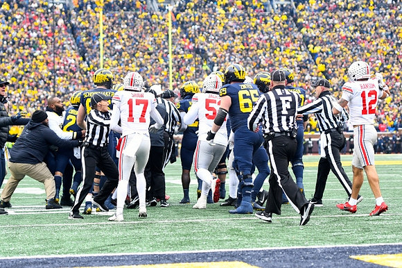 Blake Corum (2), Luke Schoonmaker (86), Hassan Haskins (25), Zak Zinter (65), and Trevor Keegan (77)