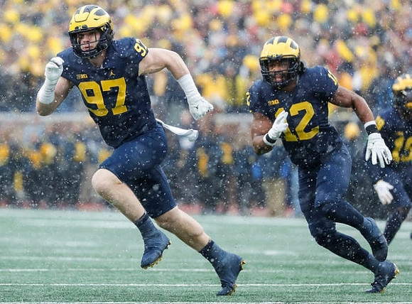 Aidan Hutchinson (97), Josh Ross (12), and Rod Moore (19)