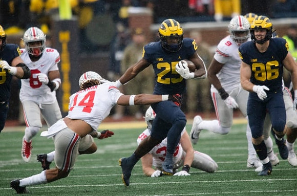 Hassan Haskins (25) and Luke Schoonmaker (86)