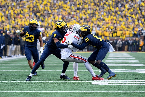 Michael Barrett (23), Vincent Gray (4), and Rod Moore (19)