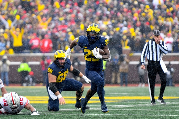Andrew Vastardis (68) and Hassan Haskins (25)