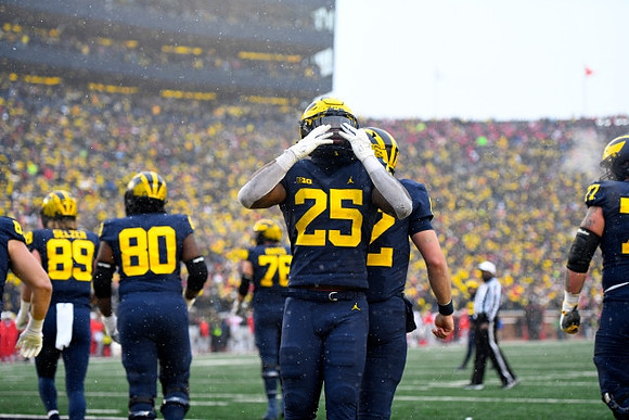 Carter Selzer (89), Trente Jones (80), Ryan Hayes (76), Hassan Haskins (25), Cade McNamara (12), and Trevor Keegan (77)