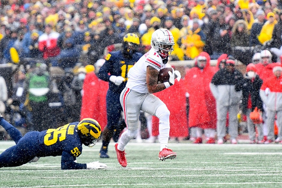 David Ojabo (55) and Christopher Hinton (15)