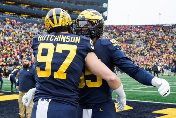 Aidan Hutchinson (97) and David Ojabo (55)