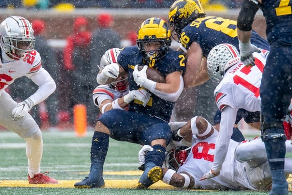 Blake Corum (2) and Luke Schoonmaker (86)