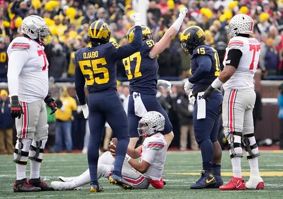 Joshua Luther (44), Aidan Hutchinson (97), and Christopher Hinton (15)