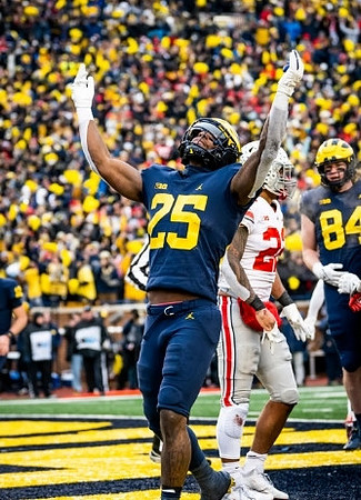 Hassan Haskins (25) and Joel Honigford (84)
