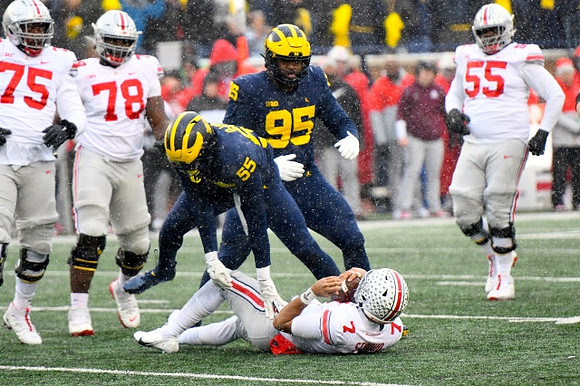 David Ojabo (55) and Donovan Jeter (95)
