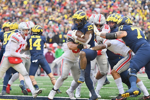 Joel Honigford (84), Roman Wilson (14), Hassan Haskins (25), and Trevor Keegan (77)