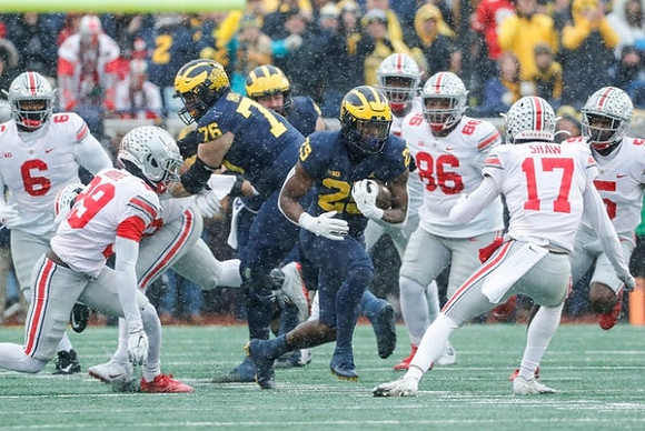 Ryan Hayes (76) and Hassan Haskins (25)