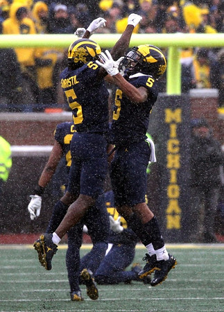 Mike Sainristil (5) and DJ Turner (5)