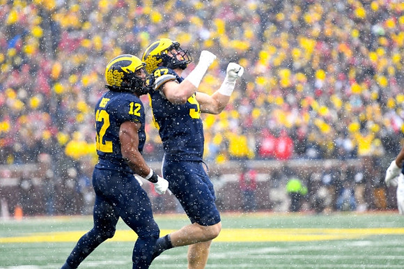 Josh Ross (12) and Aidan Hutchinson (97)