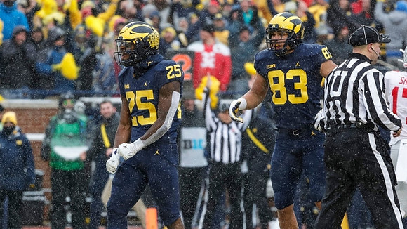 Hassan Haskins (25) and Erick All (83)