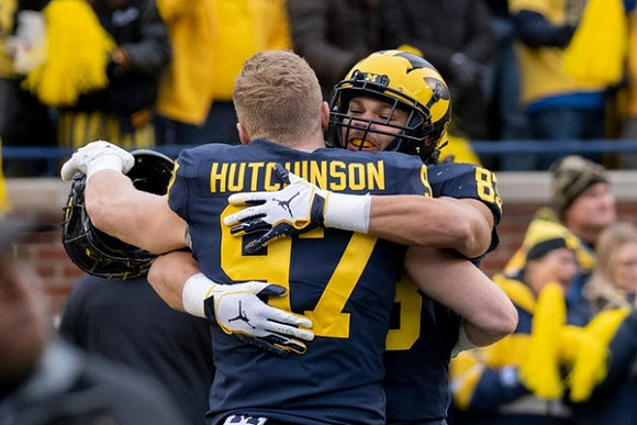 Aidan Hutchinson (97) and Erick All (83)