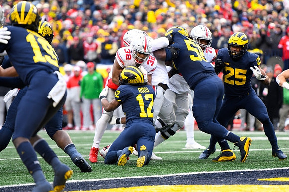 Rod Moore (19), Josh Ross (12), Mazi Smith (58), and Junior Colson (25)